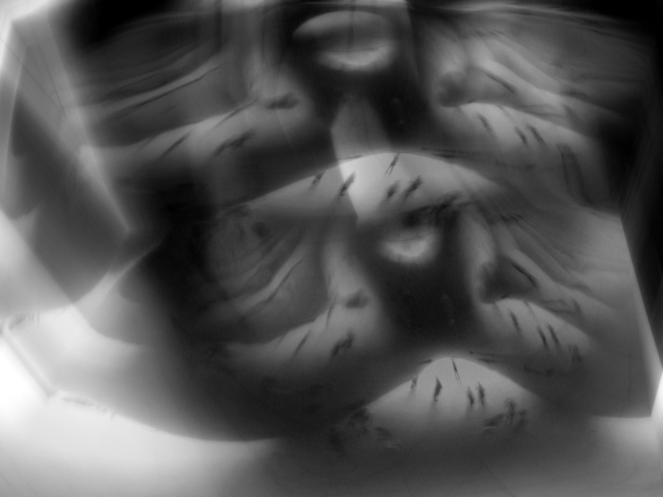 An abstract representation of memory, with a convoluted space containing tiny human figures wandering